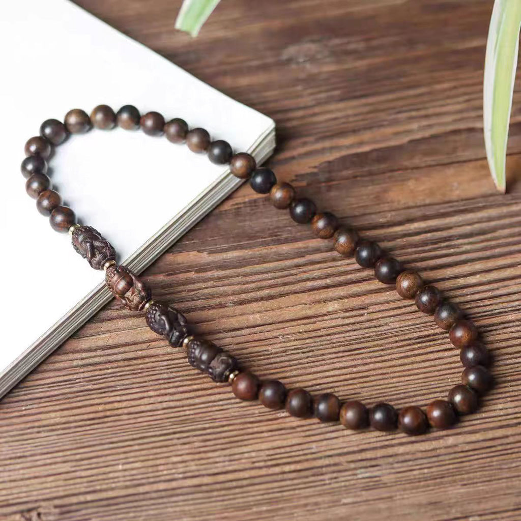 Hand‑Carved Four‑No‑Evil Buddha & Agarwood Bead Double‑Circle Bracelet – Symbol of Peace and Balance | Zen Ara Grove