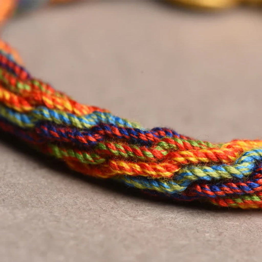 Spin Your Luck Bracelet: Handwoven Color Strings with Secret Charms