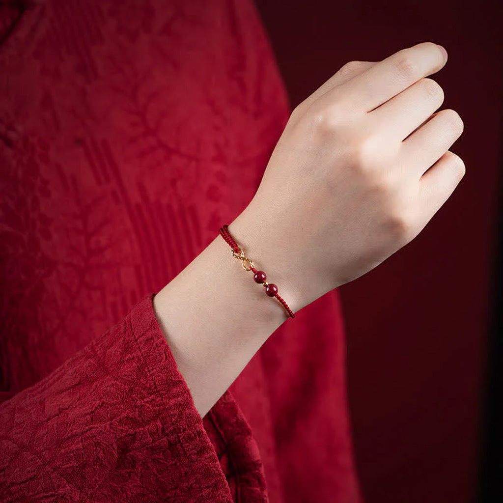 Adjustable Infinity Cord Bracelet with Cinnabar Beads