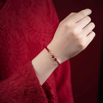 Adjustable Infinity Cord Bracelet with Cinnabar Beads