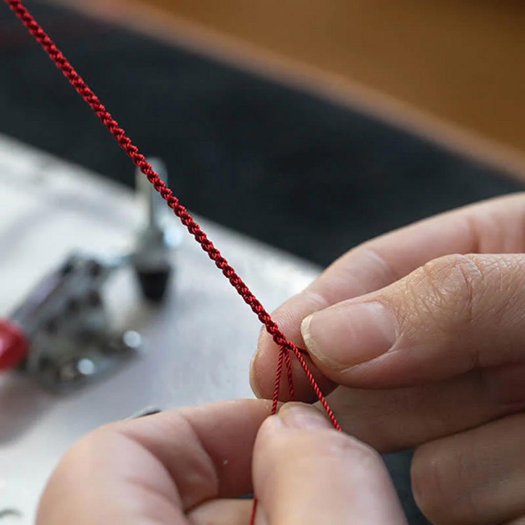 Adjustable Infinity Cord Bracelet with Cinnabar Beads
