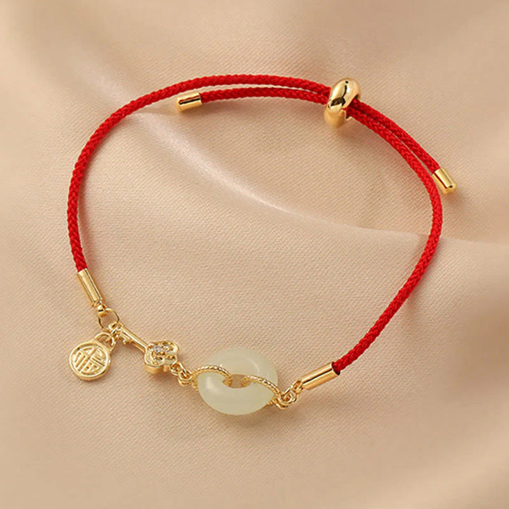 Adjustable Red Cord Bracelet with Hetian Jade Peace Buckle and Key Charm — Blessing & New Beginnings