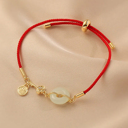 Adjustable Red Cord Bracelet with Hetian Jade Peace Buckle and Key Charm — Blessing & New Beginnings
