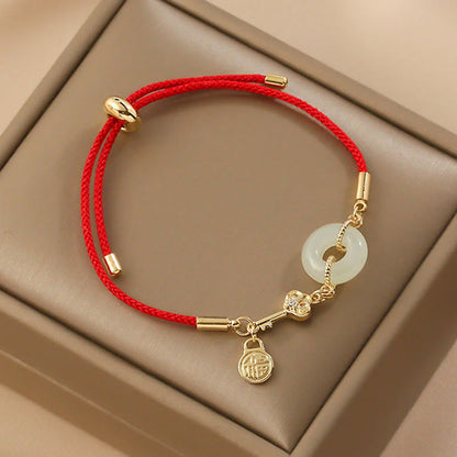 Adjustable Red Cord Bracelet with Hetian Jade Peace Buckle and Key Charm — Blessing & New Beginnings